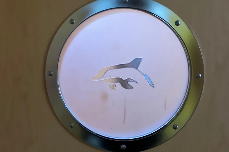 Slide: The Image of Porthole with dolphin design on Privilege 495 yacht, 2011 model. - 85
