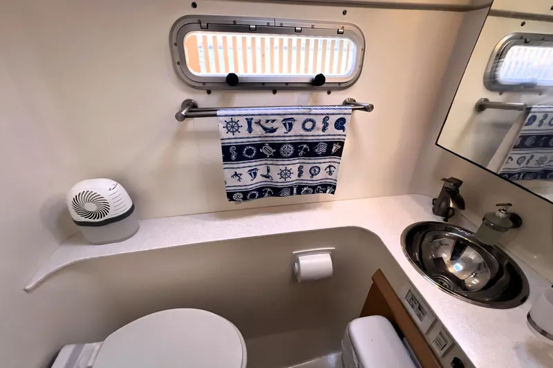 Slide: The Image of Compact marine bathroom in 2011 Privilege 495 yacht with nautical decor. - 95