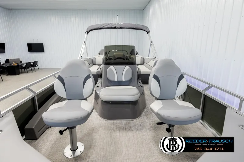 Slide: The Image of 2026 Avalon VEN85 CCF boat interior with modern seating and helm, displayed indoors. - 13