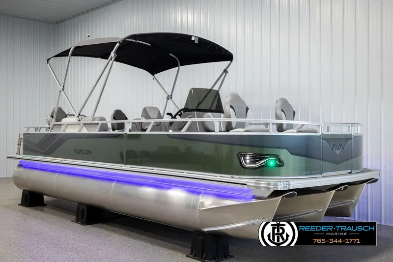 Slide: The Image of 2026 Avalon VEN85 CCF pontoon boat with canopy and LED lights in showroom. - 3