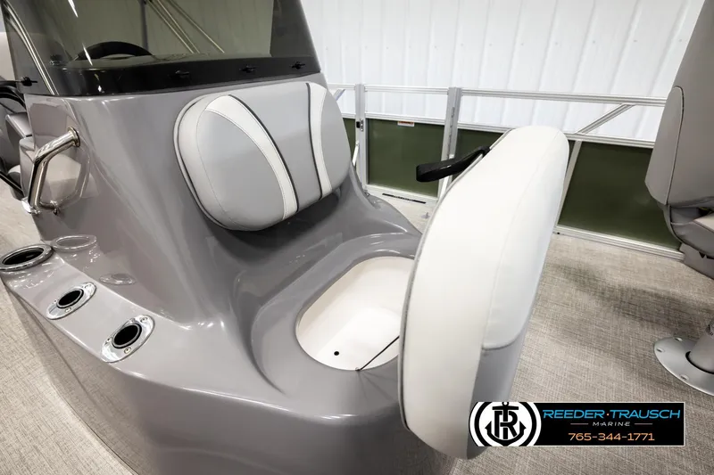 Slide: The Image of 2026 Avalon VEN85 CCF boat console with seating and cup holders in a showroom. - 30