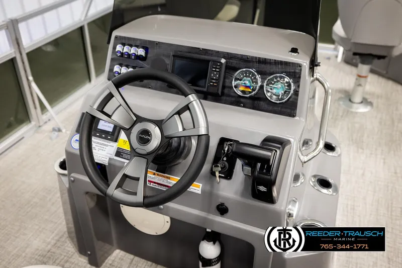 Slide: The Image of 2026 Avalon VEN85 CCF boat dashboard with steering wheel and control panel. - 31