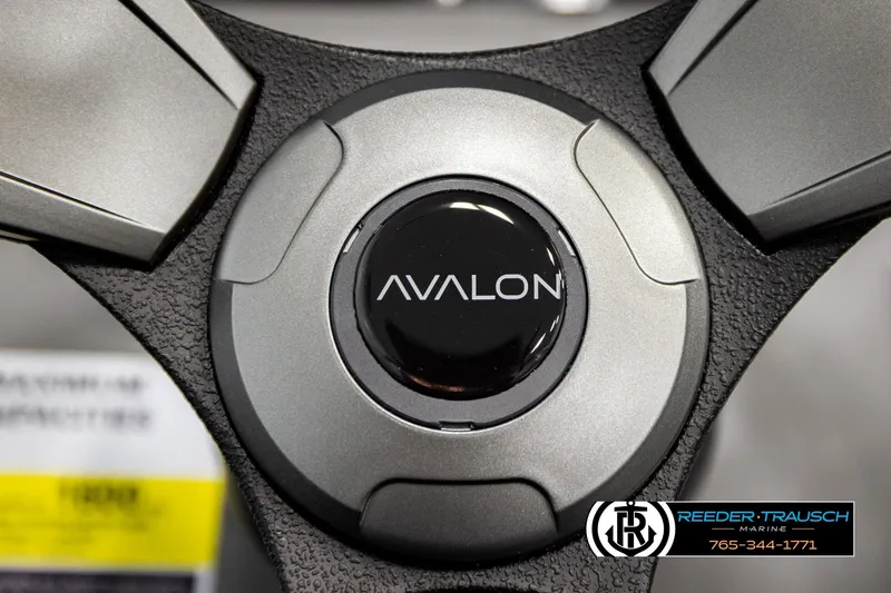 Slide: The Image of Steering wheel of 2026 Avalon VEN85 CCF boat with logo and Reeder-Trausch Marine branding. - 33