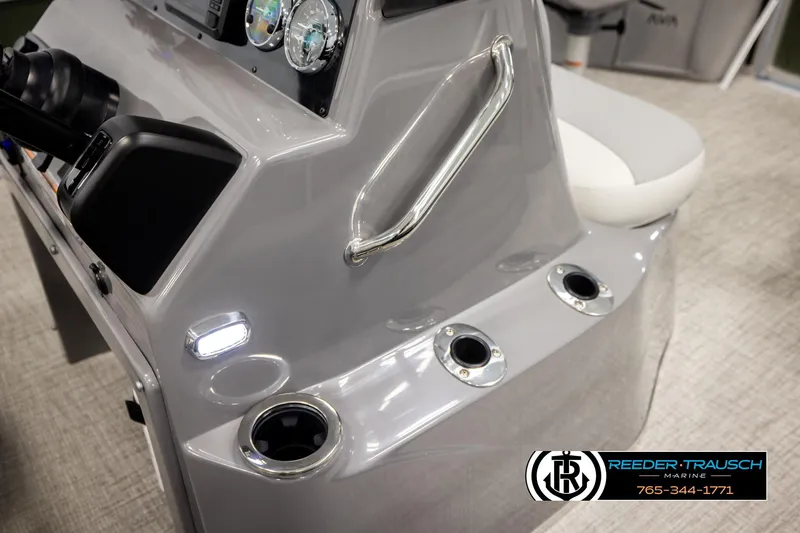 Slide: The Image of 2026 Avalon VEN85 CCF boat dashboard with gauges and cup holders, Reeder-Trausch Marine branding. - 39