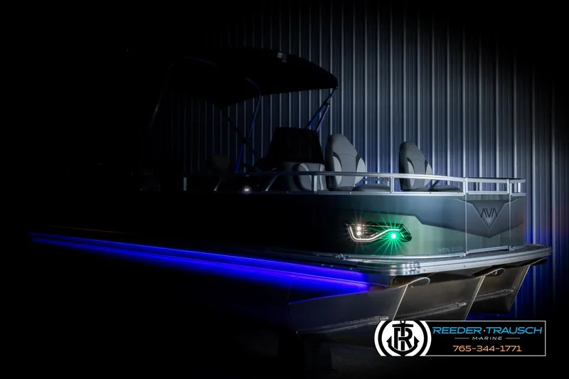 Slide: The Image of 2026 Avalon VEN85 CCF boat with blue LED lights, showcased in a dimly lit setting. - 4