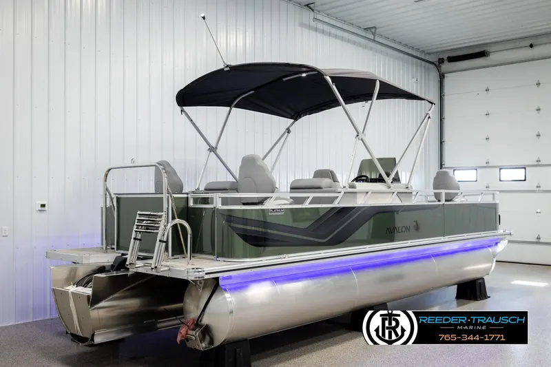 Slide: The Image of 2026 Avalon VEN85 CCF pontoon boat in showroom with canopy and modern design. - 6