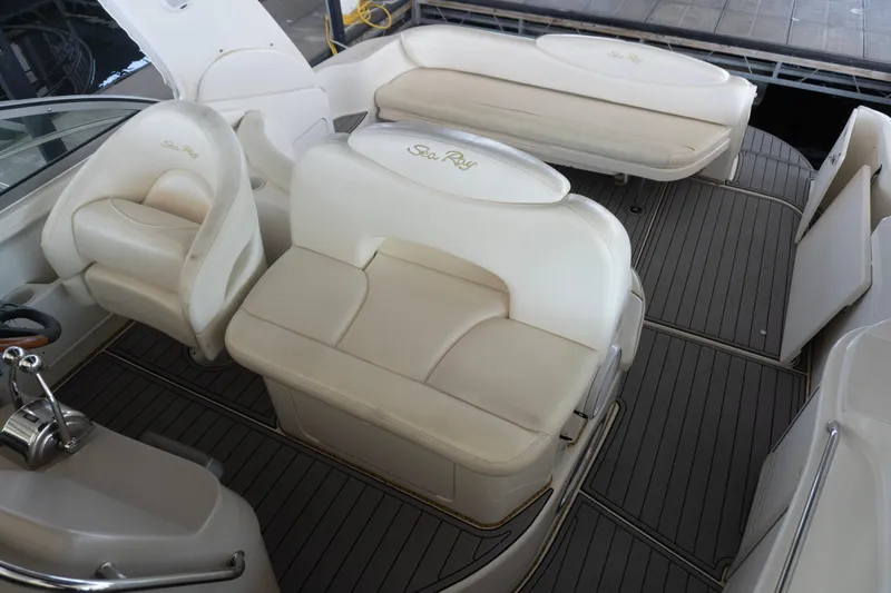 Slide: The Image of 2001 Sea Ray 340 Sundancer interior with white leather seating and sleek design. - 10