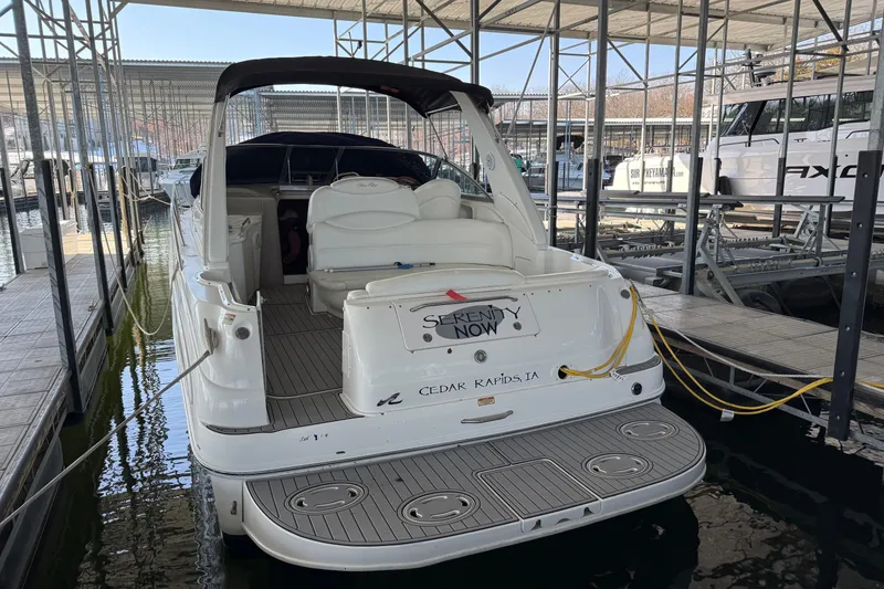 Slide: The Image of 2001 Sea Ray 340 Sundancer docked in a marina, rear view. - 2