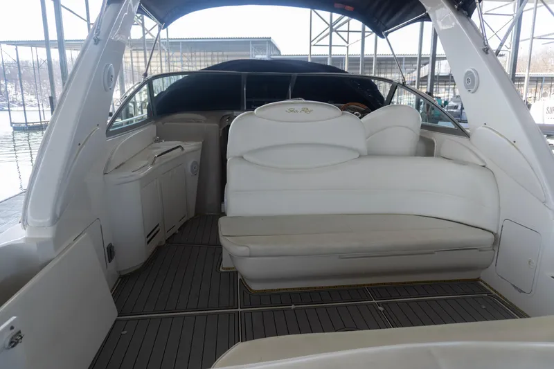 Slide: The Image of 2001 Sea Ray 340 Sundancer boat interior with white seating and sleek design. - 3