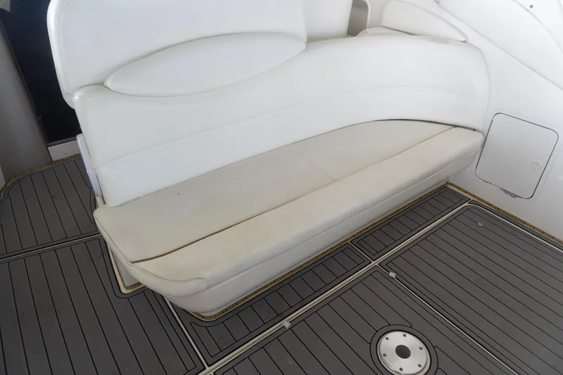 Slide: The Image of White seating on 2001 Sea Ray 340 Sundancer boat with gray deck flooring. - 7