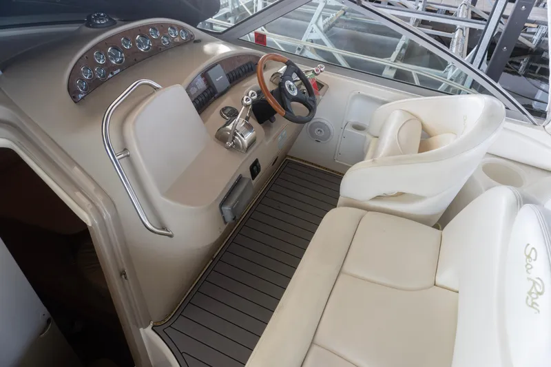 Slide: The Image of Cockpit of 2001 Sea Ray 340 Sundancer with steering wheel and control panel. - 8