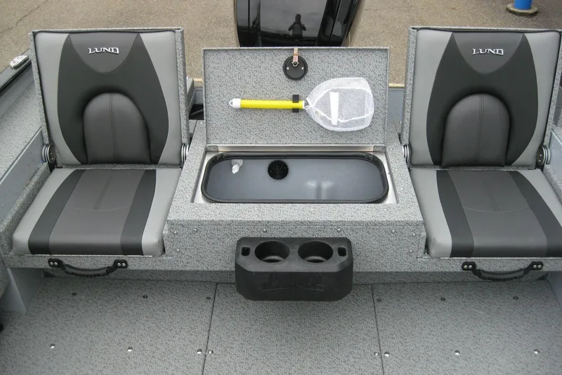 Slide: The Image of 2025 Lund 1775 Adventure SS boat interior with seating, livewell, and fishing net. - 6