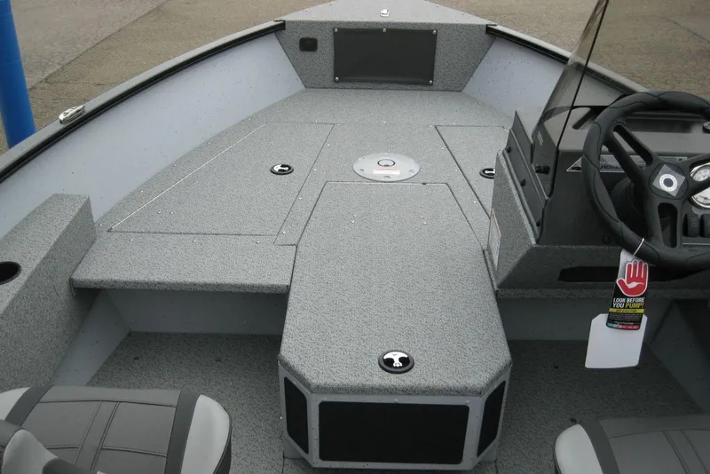 Slide: The Image of 2025 Lund 1775 Adventure SS boat interior with steering console and seating. - 9