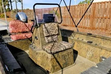 Slide: The Image of 2021 G3 Gator Tough 18 CCJ DLX boat with camouflage seating and console. - 2