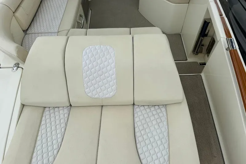 Slide: The Image of 2020 Chris-Craft Launch 28 boat cruising on water, featuring sleek design and powerful engine. - 13