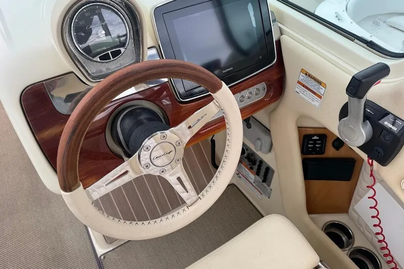 Slide: The Image of 2020 Chris-Craft Launch 28 boat interior with luxurious seating and modern dashboard. - 15