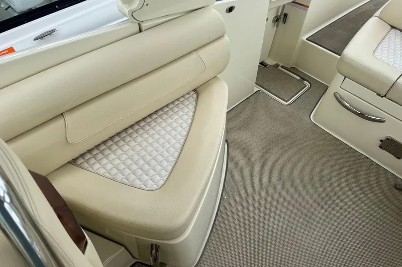 Slide: The Image of 2020 Chris-Craft Launch 28 boat docked by a scenic waterway with palm trees. - 17