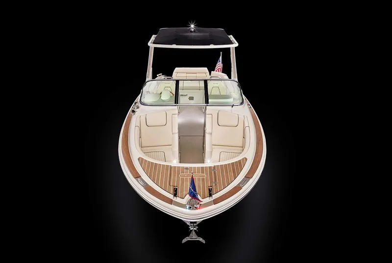 Slide: The Image of 2020 Chris-Craft Launch 28 boat cruising on a calm waterway. - 2