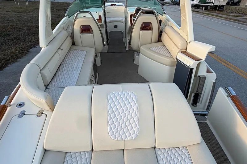 Slide: The Image of Control panel of a 2020 Chris-Craft Launch 28 boat, featuring navigation and communication equipment. - 28