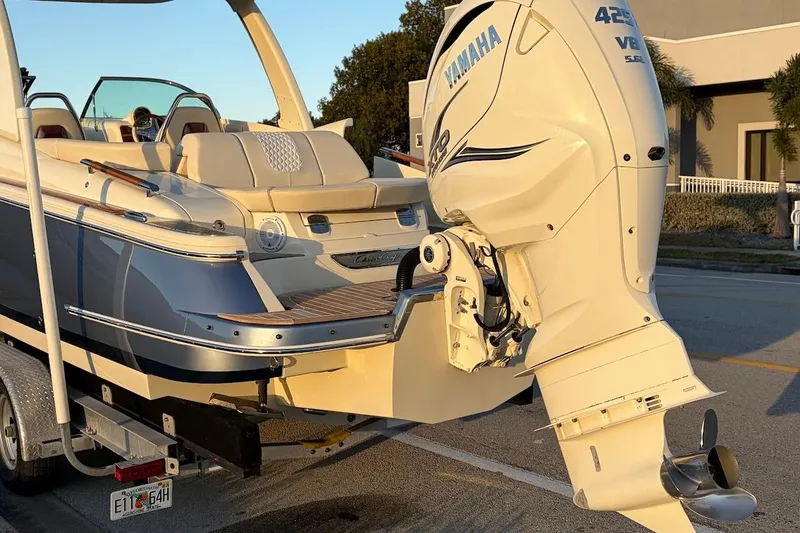 Slide: The Image of 2020 Chris-Craft Launch 28 boat interior with beige seating and waterfront view. - 33