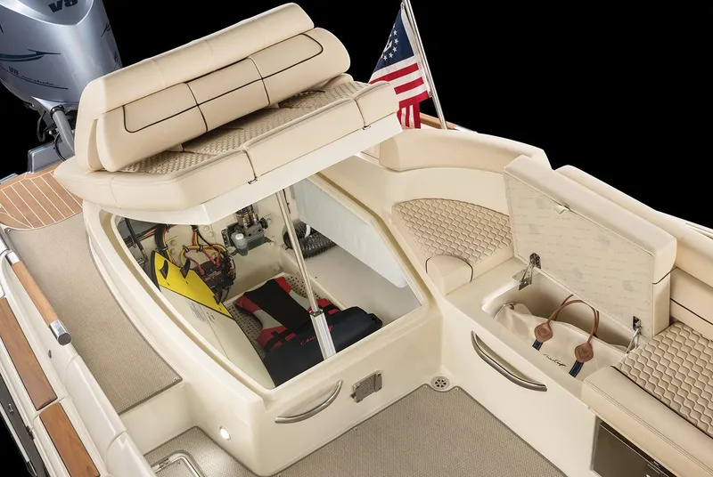 Slide: The Image of 2020 Chris-Craft Launch 28 boat cruising on a sunny day, surrounded by lush greenery. - 8