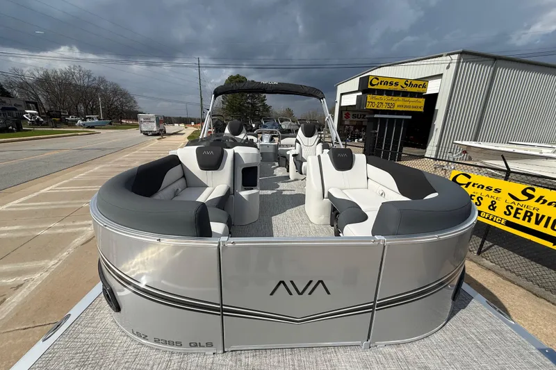 Slide: The Image of 2026 Avalon LSZ Quad Lounge Shift pontoon boat with sleek design and comfortable seating. - 10