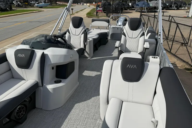 Slide: The Image of 2026 Avalon LSZ Quad Lounge Shift pontoon boat with luxurious seating and modern design. - 12