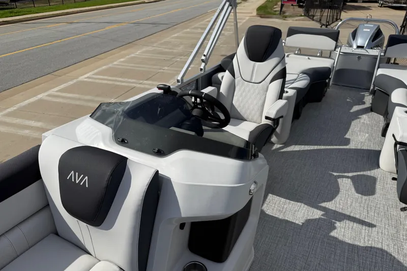 Slide: The Image of 2026 Avalon LSZ Quad Lounge Shift pontoon boat interior with modern seating and steering console. - 14