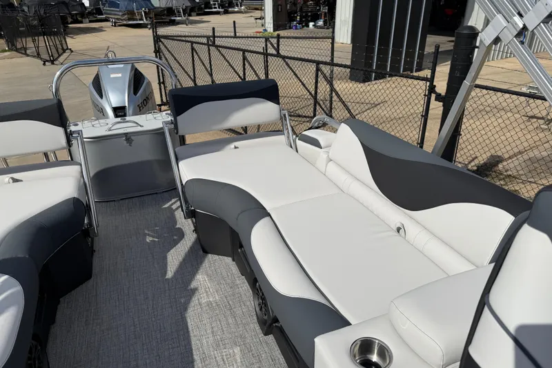 Slide: The Image of 2026 Avalon LSZ Quad Lounge Shift pontoon boat interior with plush seating and Honda motor. - 18