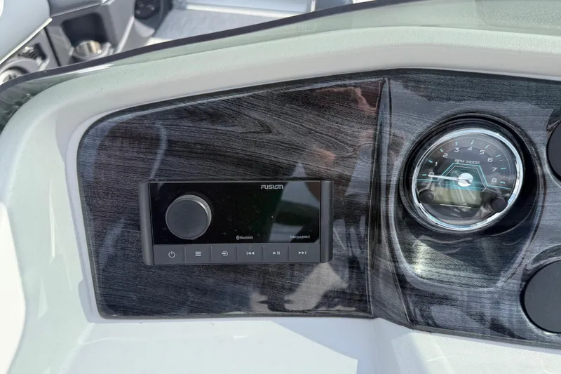 Slide: The Image of Dashboard of 2026 Avalon LSZ Quad Lounge Shift with audio controls and RPM gauge. - 25