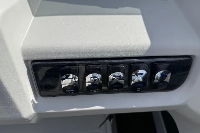 Slide: The Image of Control panel of 2026 Avalon LSZ Quad Lounge Shift with labeled switches. - 26