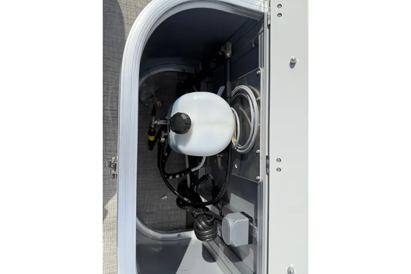 Slide: The Image of 2026 Avalon LSZ Quad Lounge Shift storage compartment with mechanical components. - 38