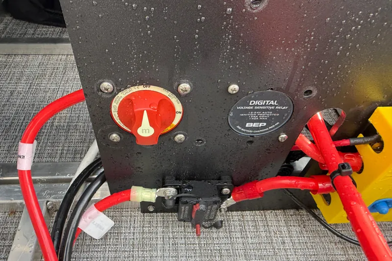 Slide: The Image of Close-up of electrical panel with red cables on 2026 Avalon LSZ Quad Lounge Shift. - 40