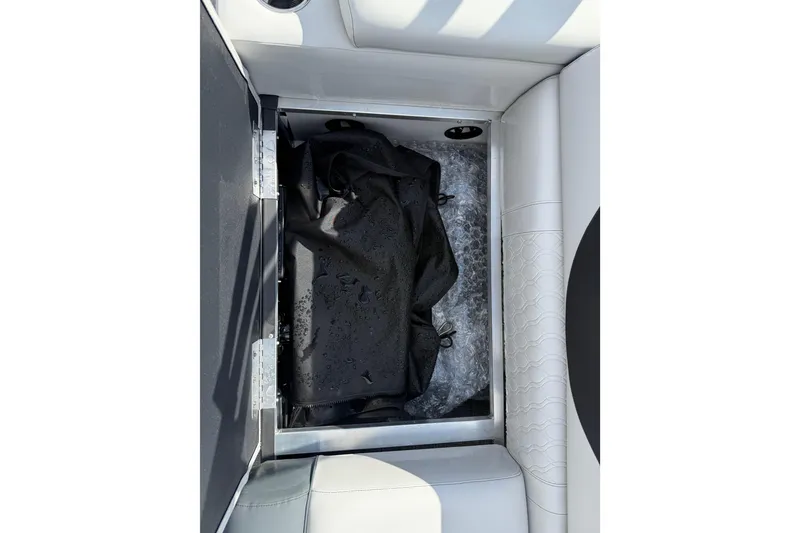 Slide: The Image of 2026 Avalon LSZ Quad Lounge Shift storage compartment with black cover and white seating. - 41