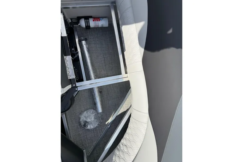 Slide: The Image of 2026 Avalon LSZ Quad Lounge Shift storage compartment with fire extinguisher and accessories. - 45