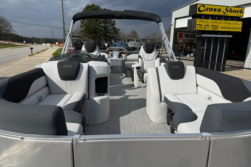 Slide: The Image of 2026 Avalon LSZ Quad Lounge Shift pontoon boat with luxurious seating and modern design. - 9