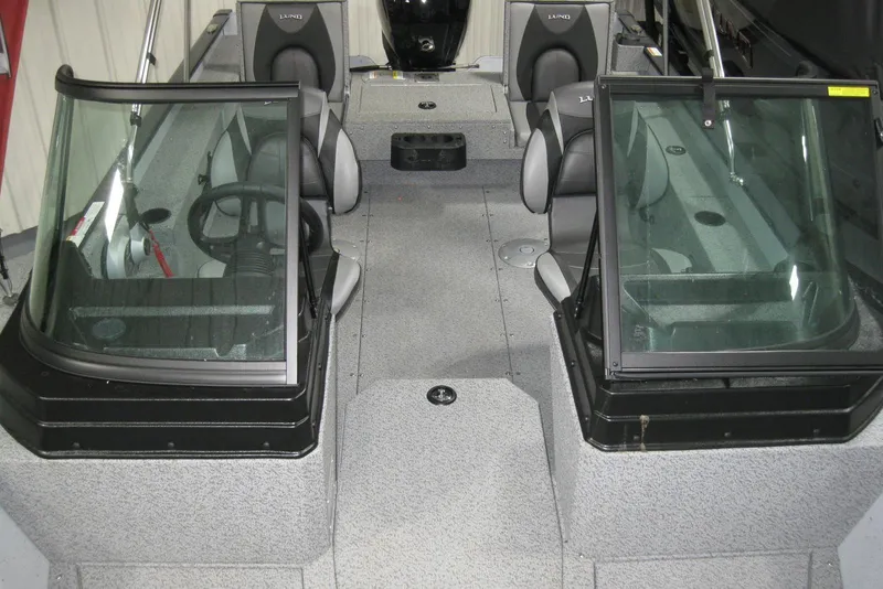 Slide: The Image of 2025 Lund 1775 Adventure Sport boat interior with seating and windshield. - 10