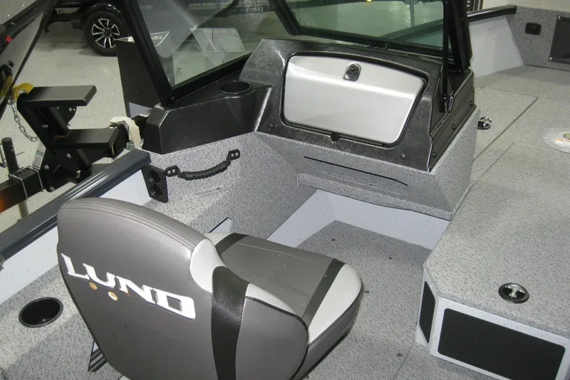 Slide: The Image of 2025 Lund 1775 Adventure Sport boat interior with seating and dashboard. - 6
