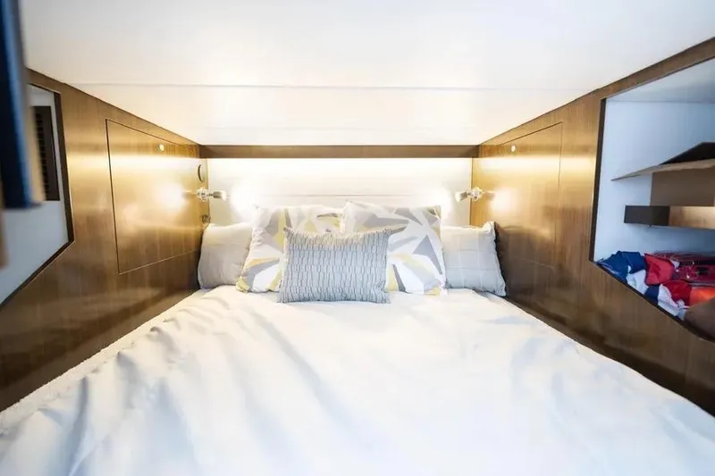 Slide: The Image of Luxurious cabin interior of 2021 Cruisers Yachts 38 GLS OB with cozy bedding. - 26