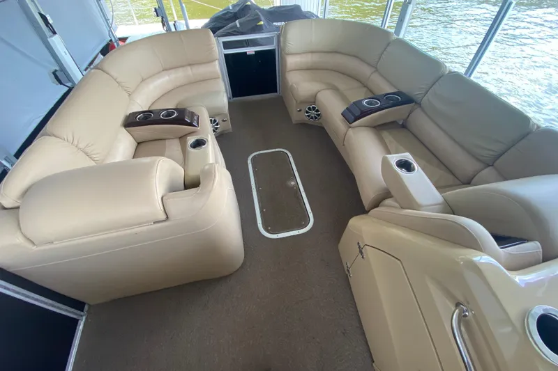 Slide: The Image of Luxurious seating area on a 2012 Bennington 2575 QCW I/O boat with cup holders. - 11