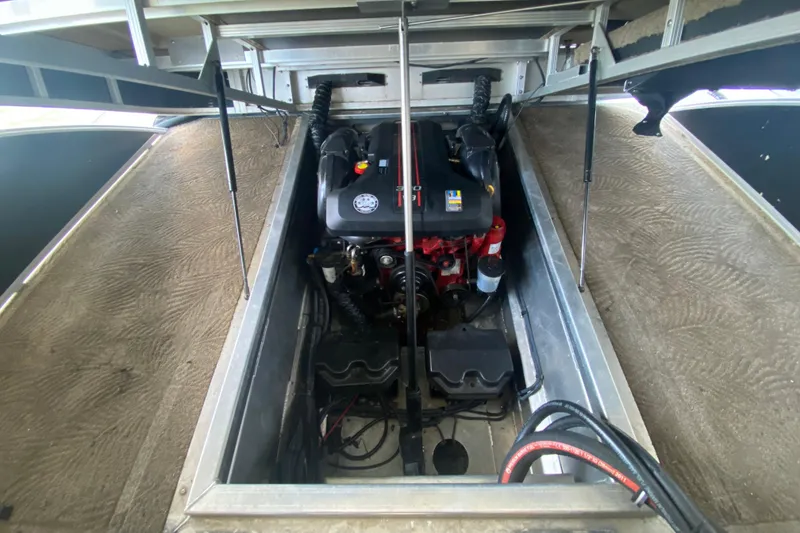 Slide: The Image of Engine compartment of a 2012 Bennington 2575 QCW I/O boat, showcasing internal components. - 22