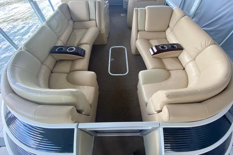 Slide: The Image of Luxurious seating on a 2012 Bennington 2575 QCW I/O pontoon boat interior. - 5