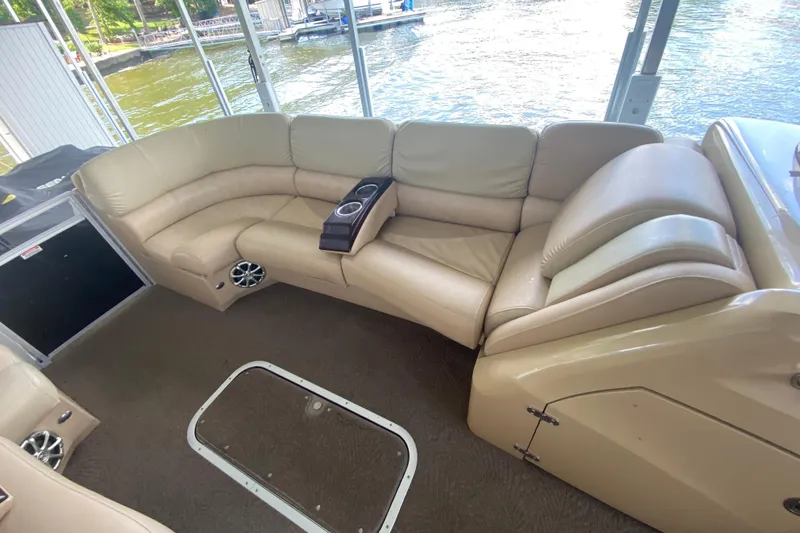 Slide: The Image of Luxurious seating on a 2012 Bennington 2575 QCW I/O pontoon boat with lake view. - 7