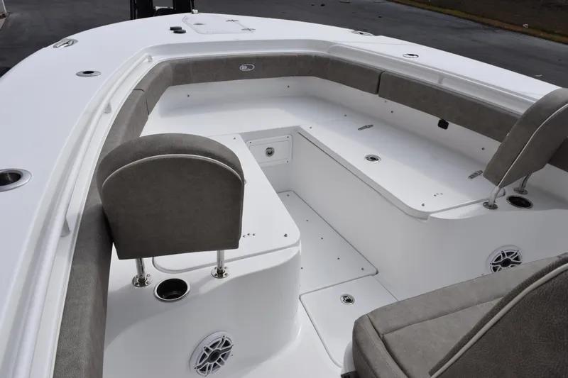 Slide: The Image of 2026 Sea Hunt Ultra 285 SE boat interior with cushioned seating and storage compartments. - 12