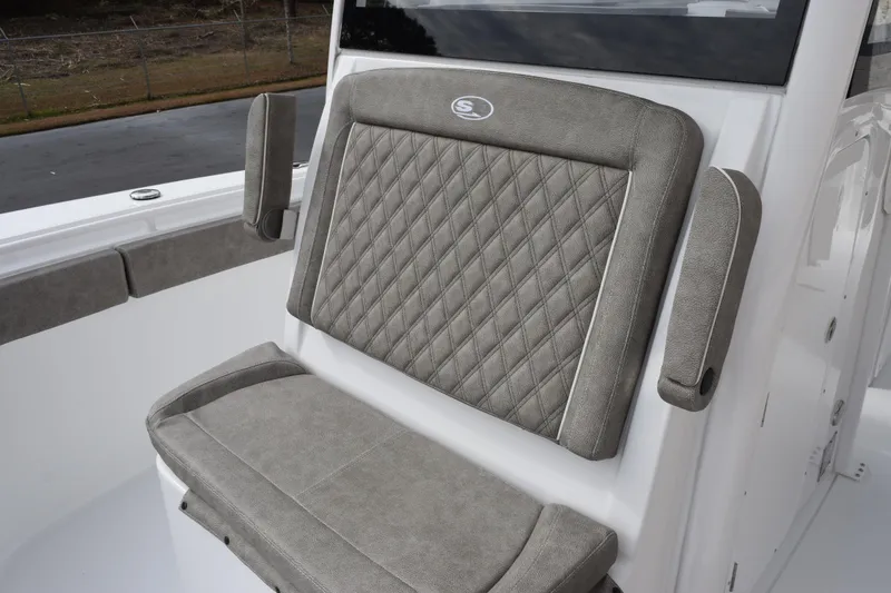 Slide: The Image of 2026 Sea Hunt Ultra 285 SE boat seat with diamond-stitched upholstery and armrests. - 13
