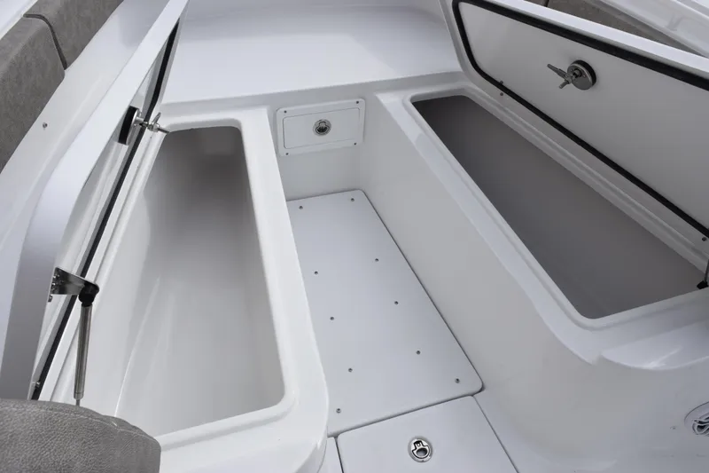 Slide: The Image of Storage compartments on the 2026 Sea Hunt Ultra 285 SE boat, showcasing spacious interior design. - 14