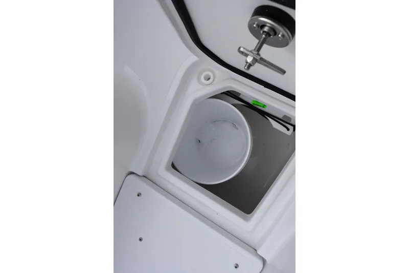 Slide: The Image of Storage compartment with bucket on 2026 Sea Hunt Ultra 285 SE boat. - 15
