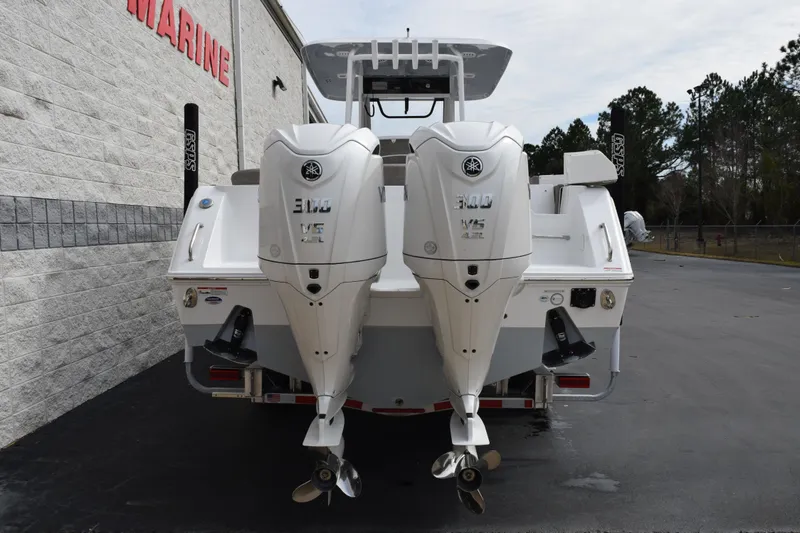 Slide: The Image of 2026 Sea Hunt Ultra 285 SE boat with dual Yamaha 300 V6 engines, rear view. - 5