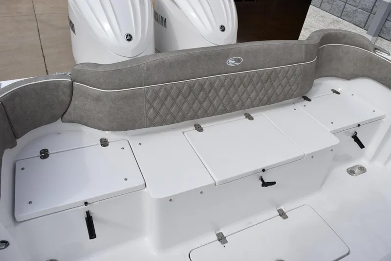 Slide: The Image of 2026 Sea Hunt Ultra 285 SE boat seating and storage compartments. - 7