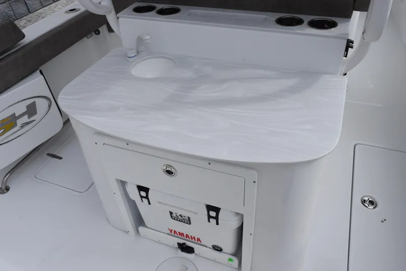 Slide: The Image of 2026 Sea Hunt Ultra 285 SE boat interior with sink and storage area. - 8